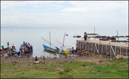 Photograph of water level well below a dock on the shore of Lake Victoria